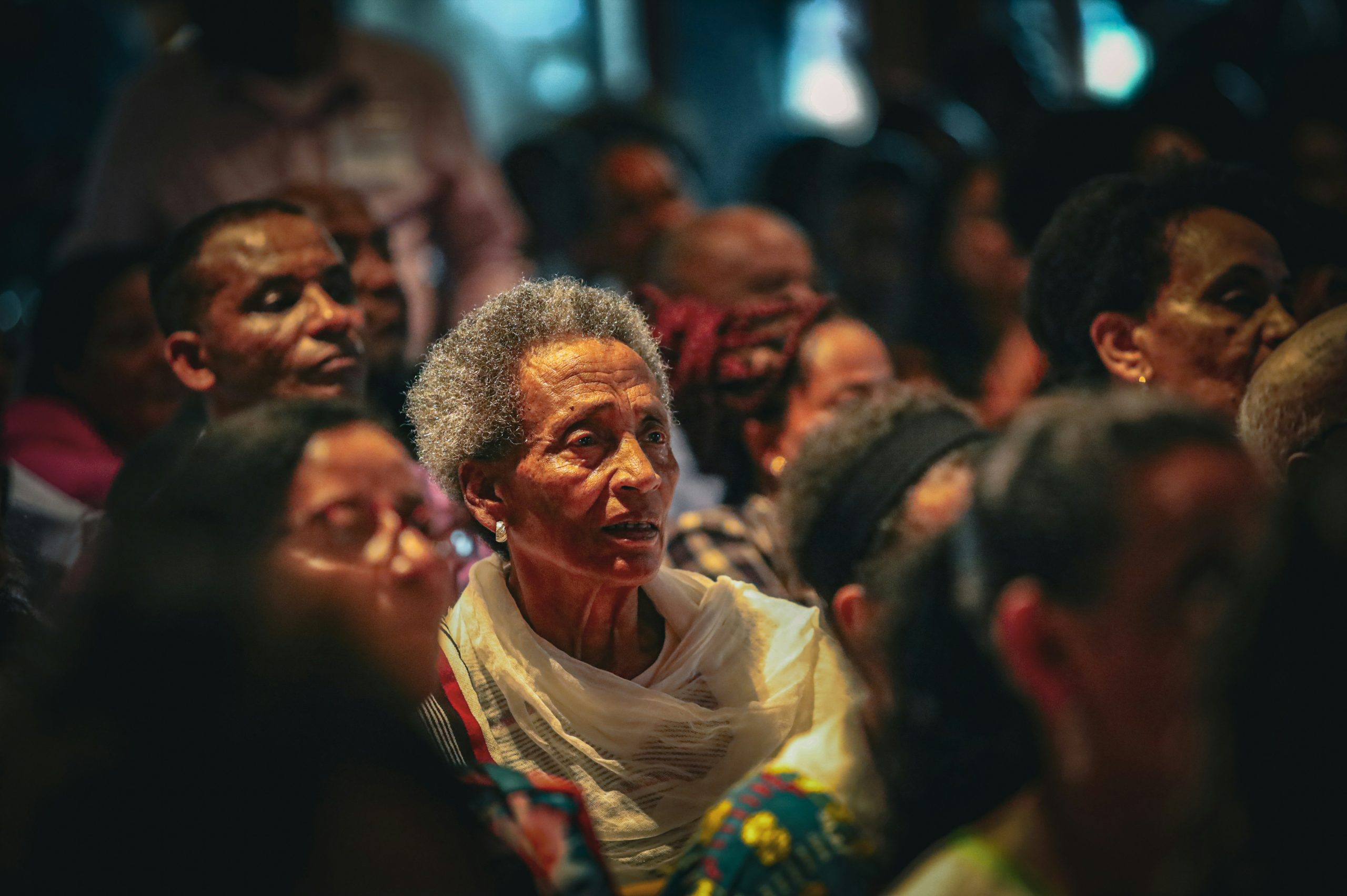 An African American Elder sitting in Church, but still lonely